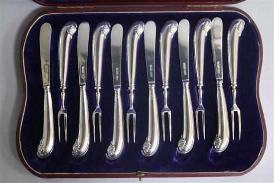 A cased set of six pairs of Edwardian silver pistol handled dessert eaters by James Dixon & Sons, Sheffield, 1901.